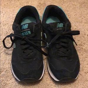 Black, purple & teal New Balance shoes